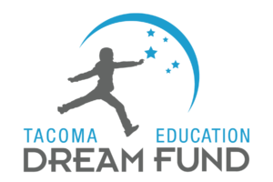 Logo for the Tacoma Education Dream Fund - A dark gray silhouette of a child leaps over the word Tacoma to reach for blue stars sprinkled in the sky.